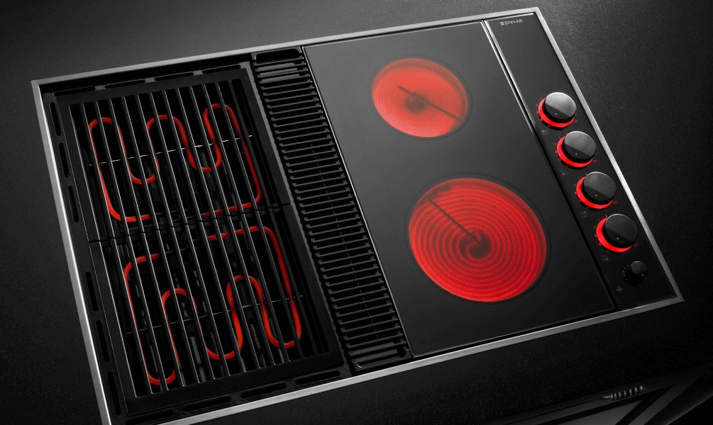 JennAir® electric cooktop with heating elements turned on