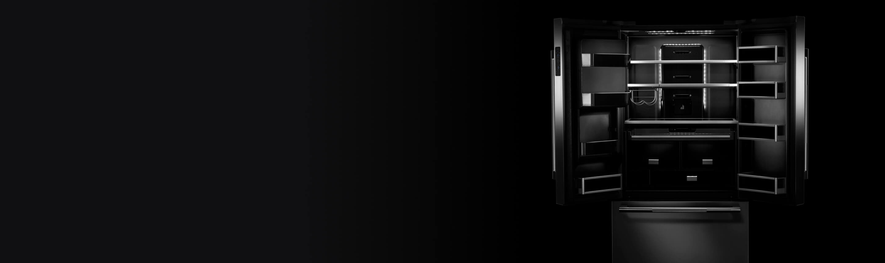 An open JennAir freestanding refrigerator showcasing the Daring Obsidian Interior. 