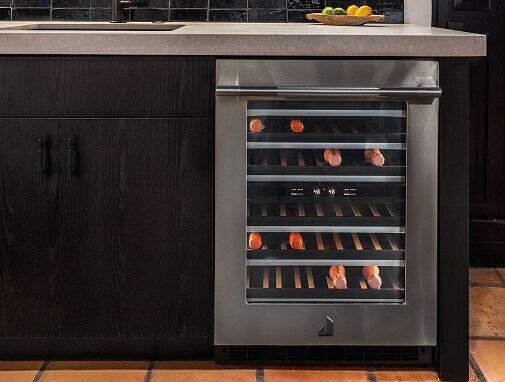A built-in wine refrigerator seamlessly integrated into modern kitchen cabinetry