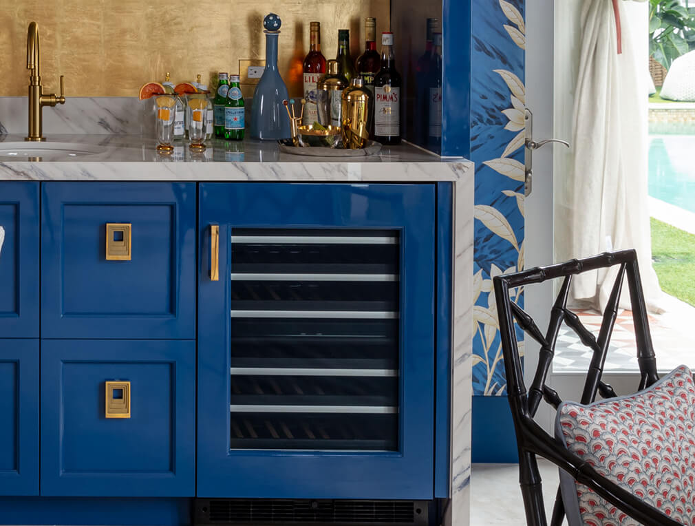 A panel-ready wine and beverage refrigerator in a kitchen island