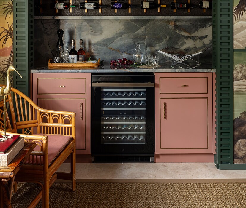 An undercounter wine refrigerator in a mini bar