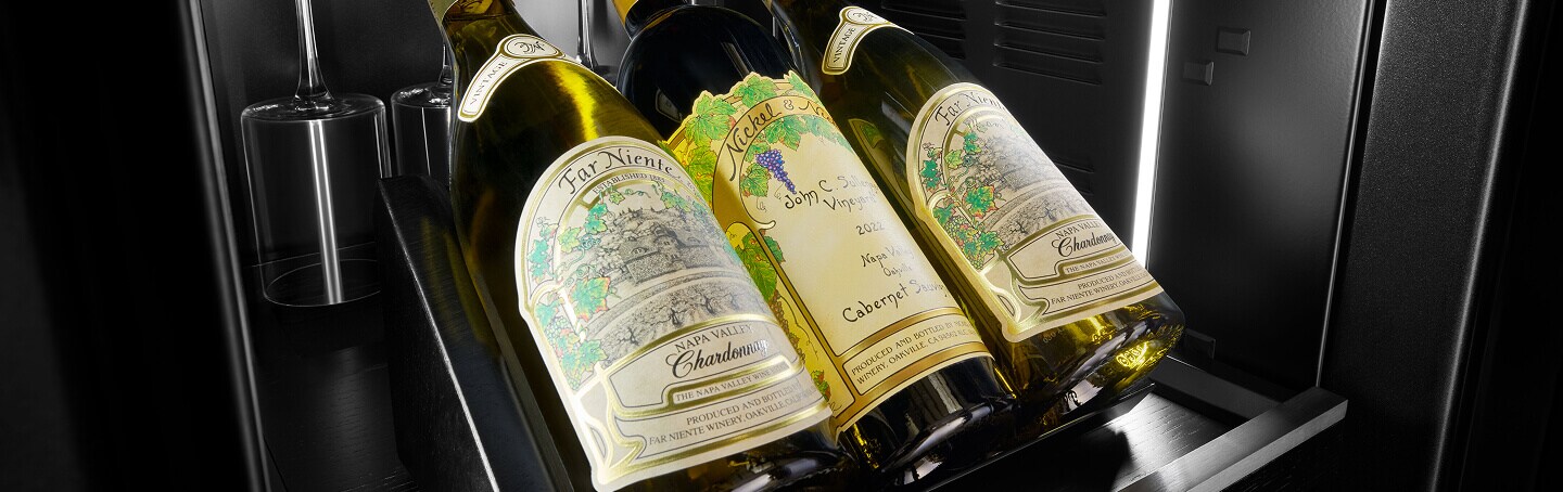 Interior of JennAir® Wine Column with illuminated bottles and Obsidian finish