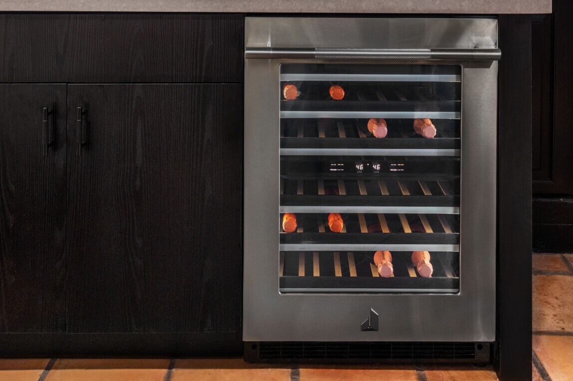 A built-in wine refrigerator seamlessly integrated into modern kitchen cabinetry.]