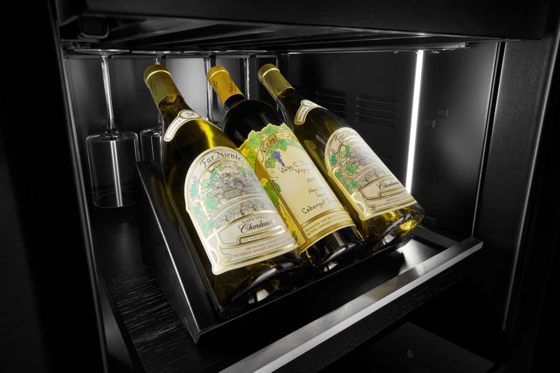 Interior of JennAir® Wine Column with illuminated bottles and Obsidian finish.