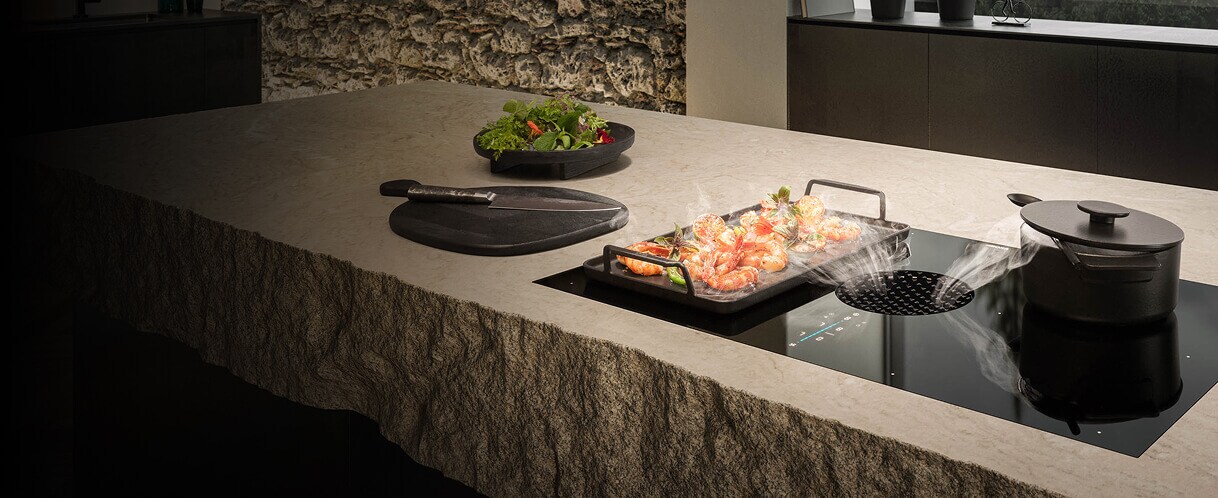 An induction downdraft cooktop in a luxury kitchen.