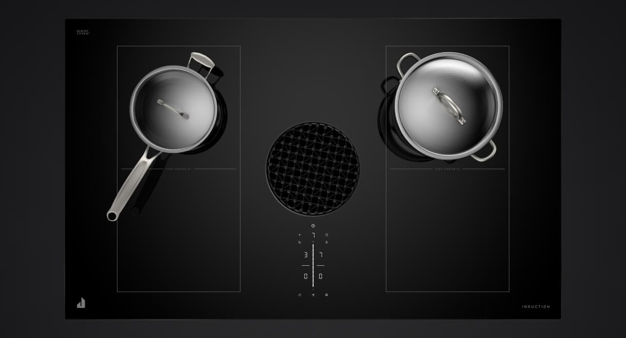 Two stainless pans on a downdraft induction cooktop.