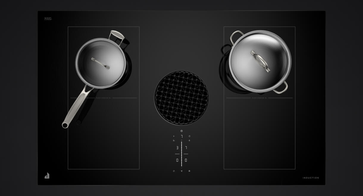 Two stainless pans on a downdraft induction cooktop.