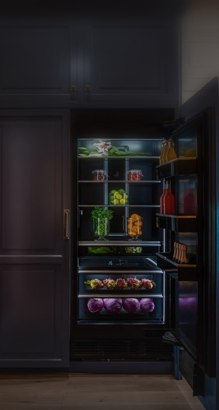 A JennAir® Column pair with custom panels in a real kitchen.