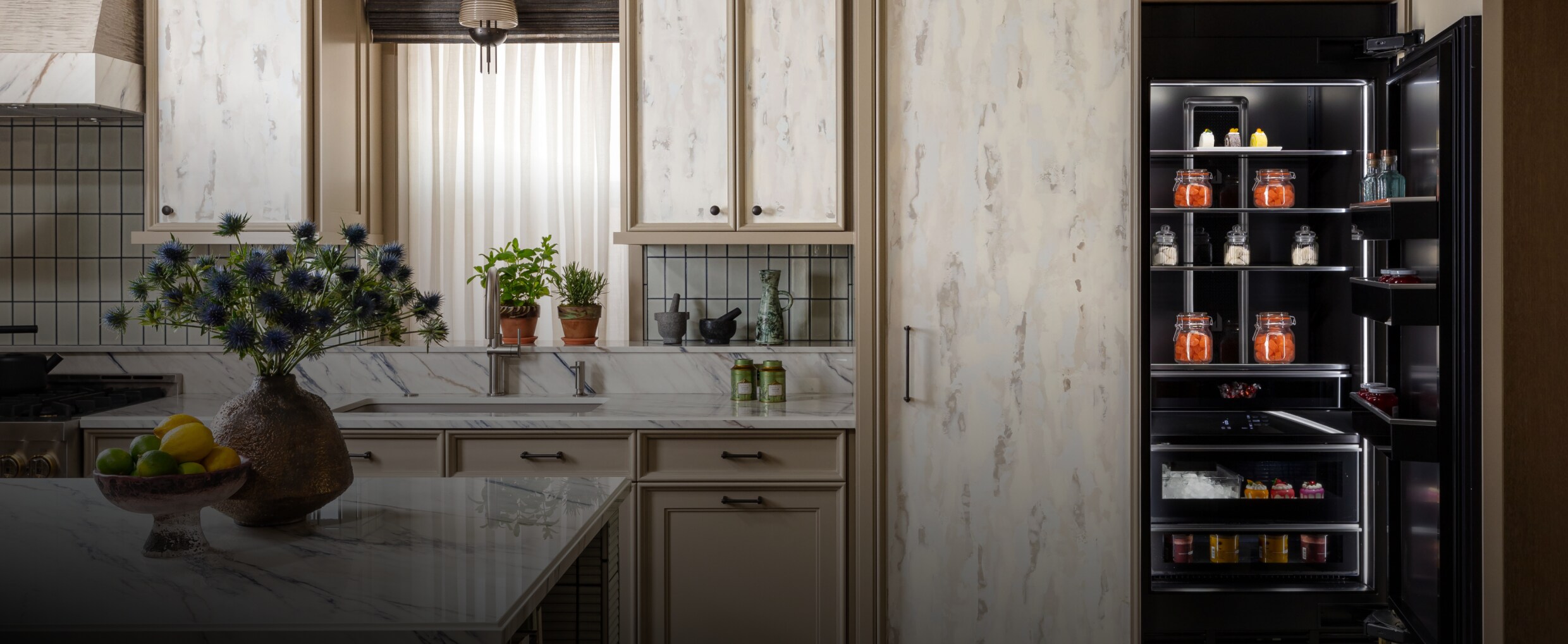 A luxury kitchen with a custom panel clad column.