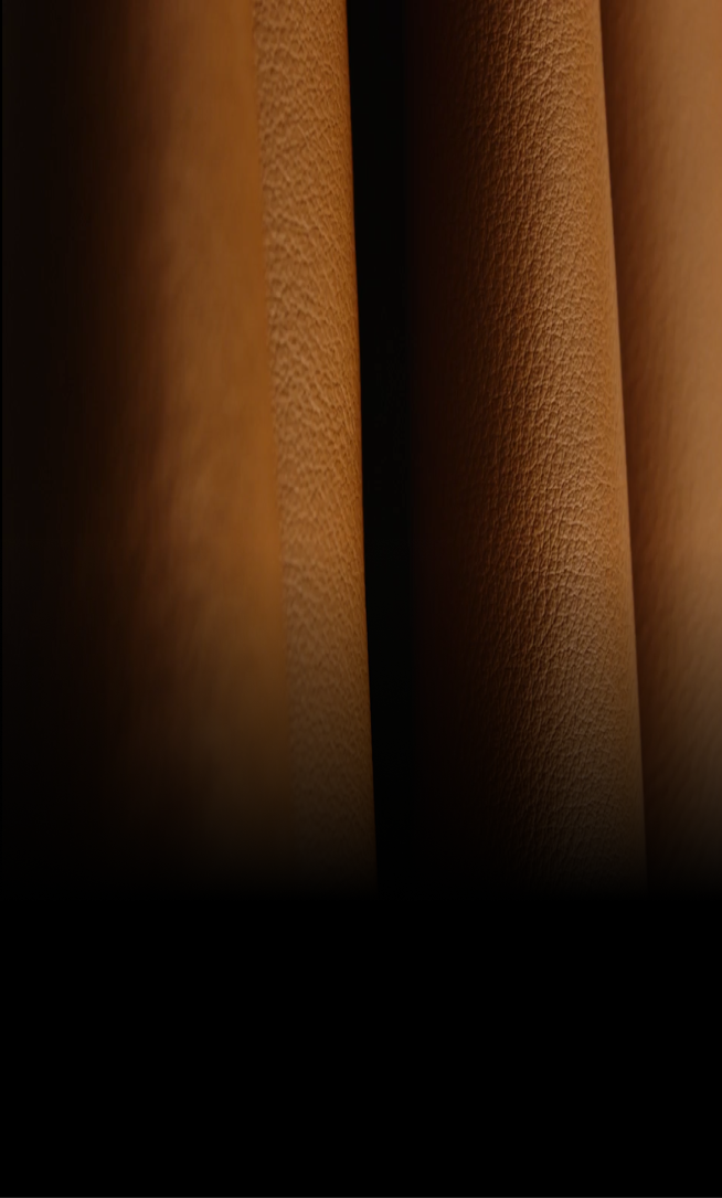 A close-up view of the texture of the amber-colored Cognac leather.