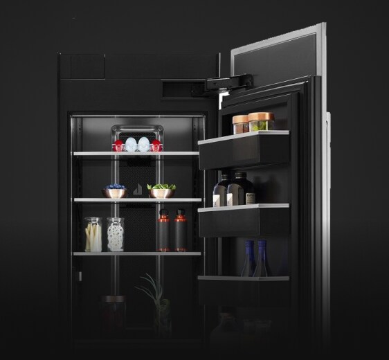 An open Column Refrigerator, propped with fine foods, luxury ingredients and high-end dishware. 
