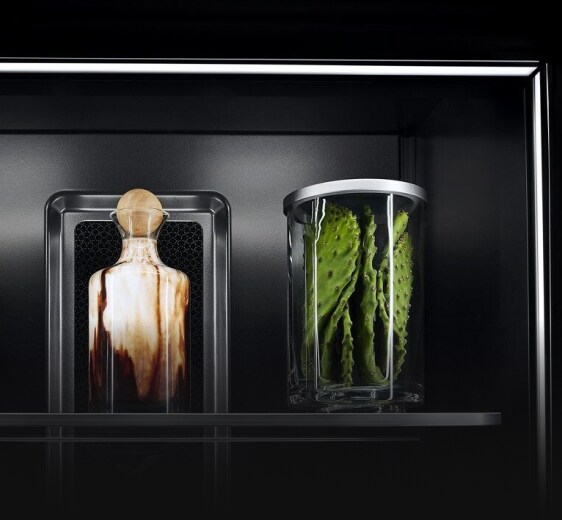 Ecliptic Lighting showcasing fine ingredients in luxury glassware against the Obsidian interior. 