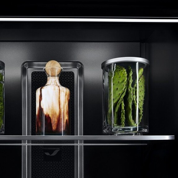 Ecliptic Lighting showcasing fine ingredients in luxury glassware against the Obsidian interior. 