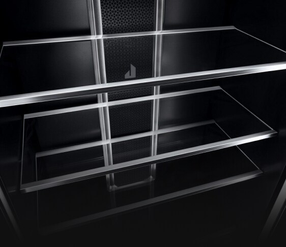 Glass shelves with metal trim in the interior of a JennAir® Column Refrigerator.