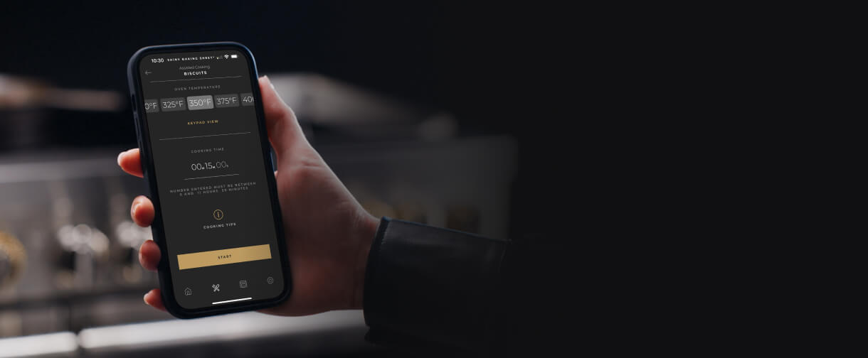 A phone with an image of the JennAir® App on it.