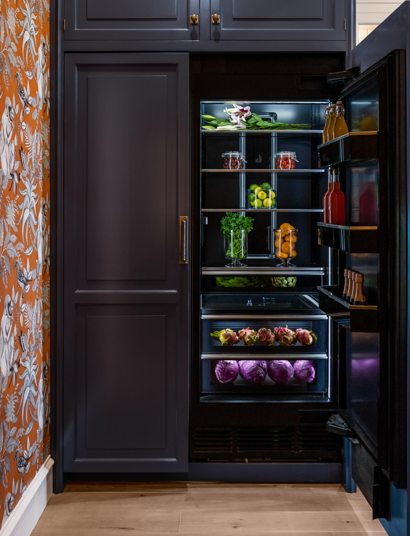 A pair of JennAir® Columns fitted with custom wooden panels.