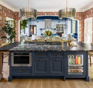 An overall view of the kitchen, showing a microwave drawer and beverage center.