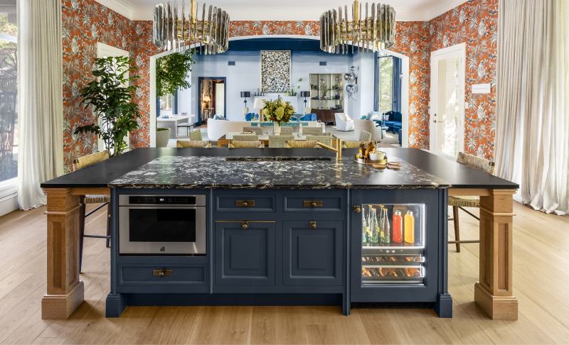 An overall view of the kitchen, showing a microwave drawer and beverage center.