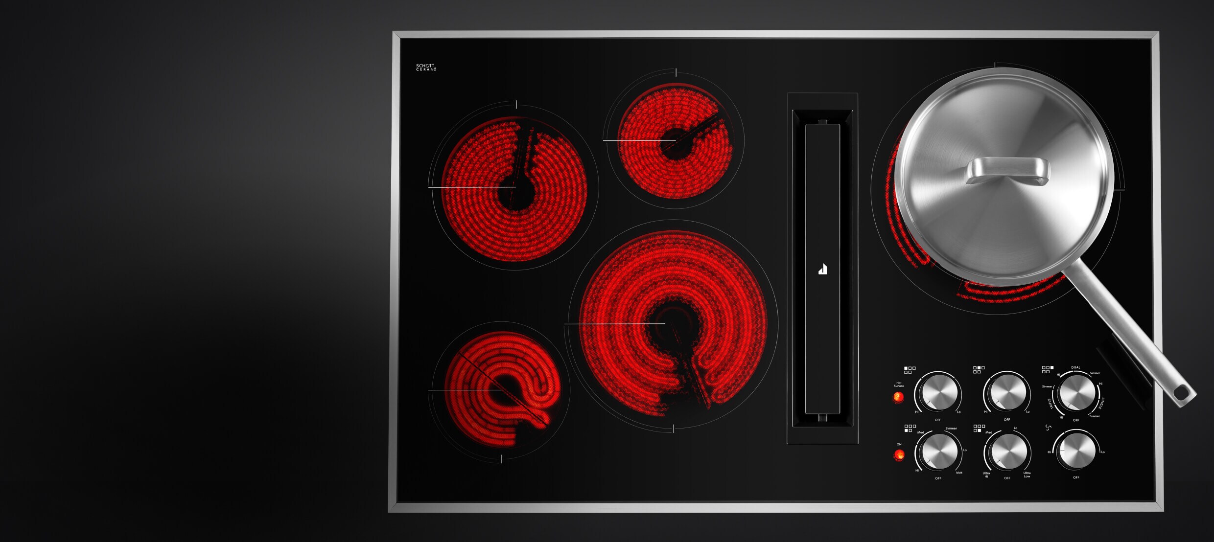 Top-down view of an electric radiant cooktop with the elements glowing red.