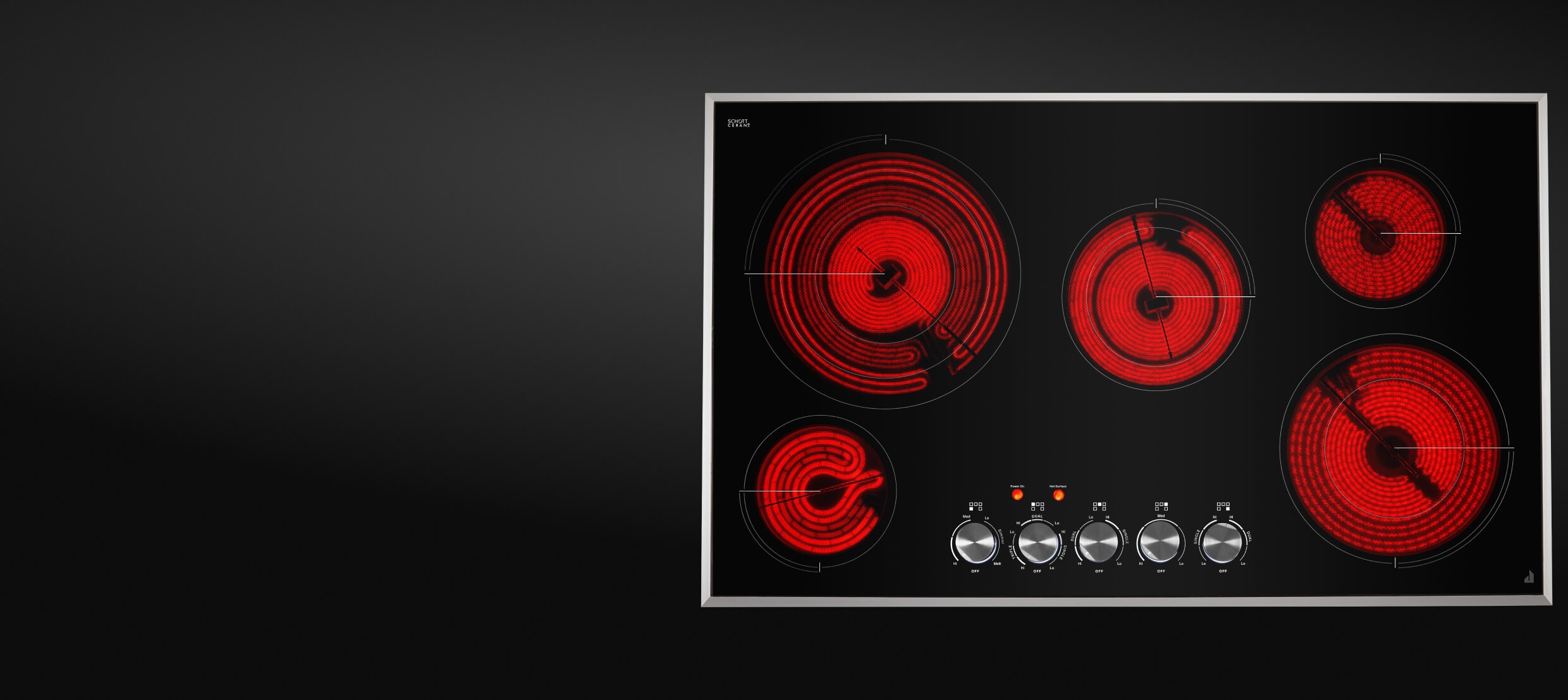Top-down view of an electric radiant cooktop with the elements glowing red.