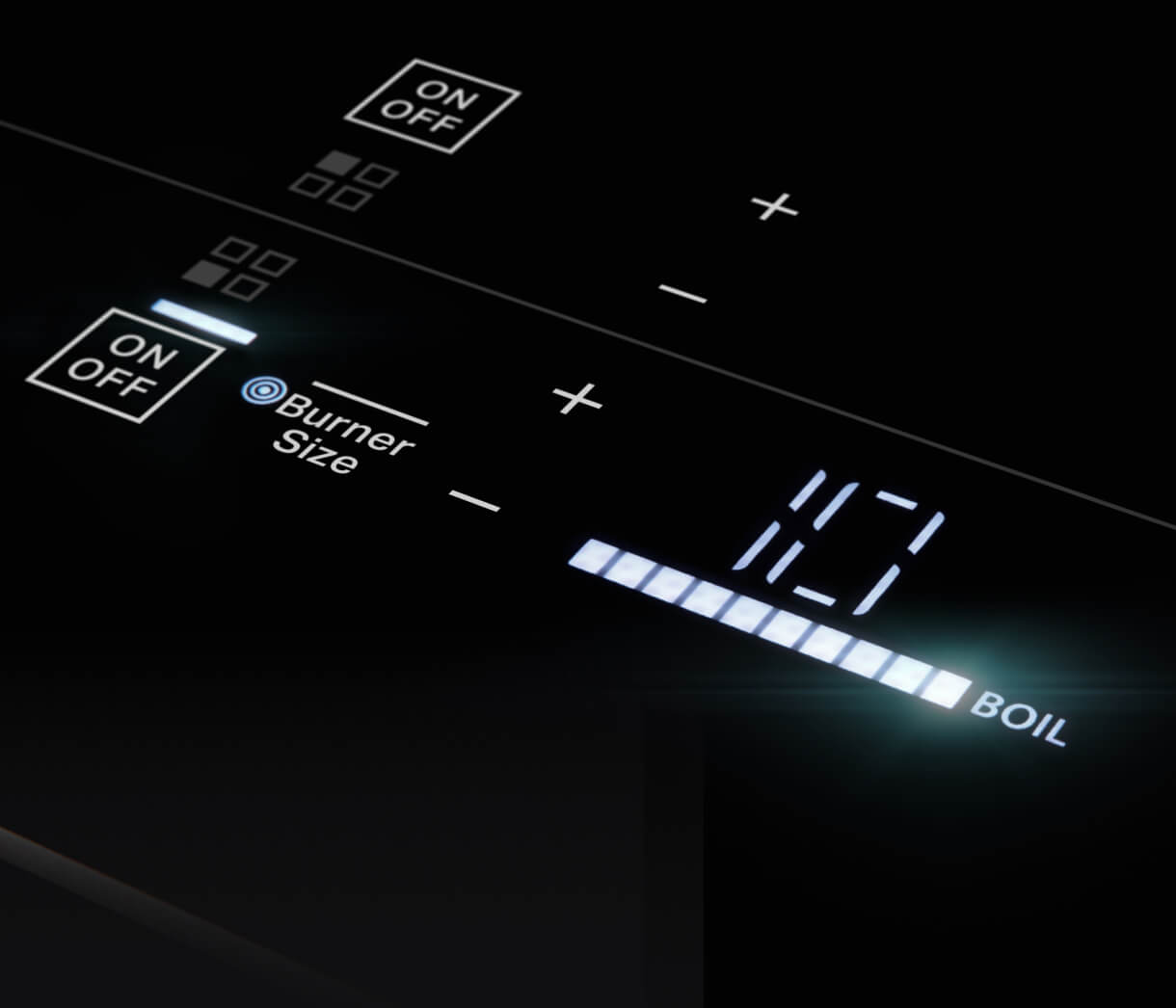 Closeup of lit emotive controls on a cooktop.