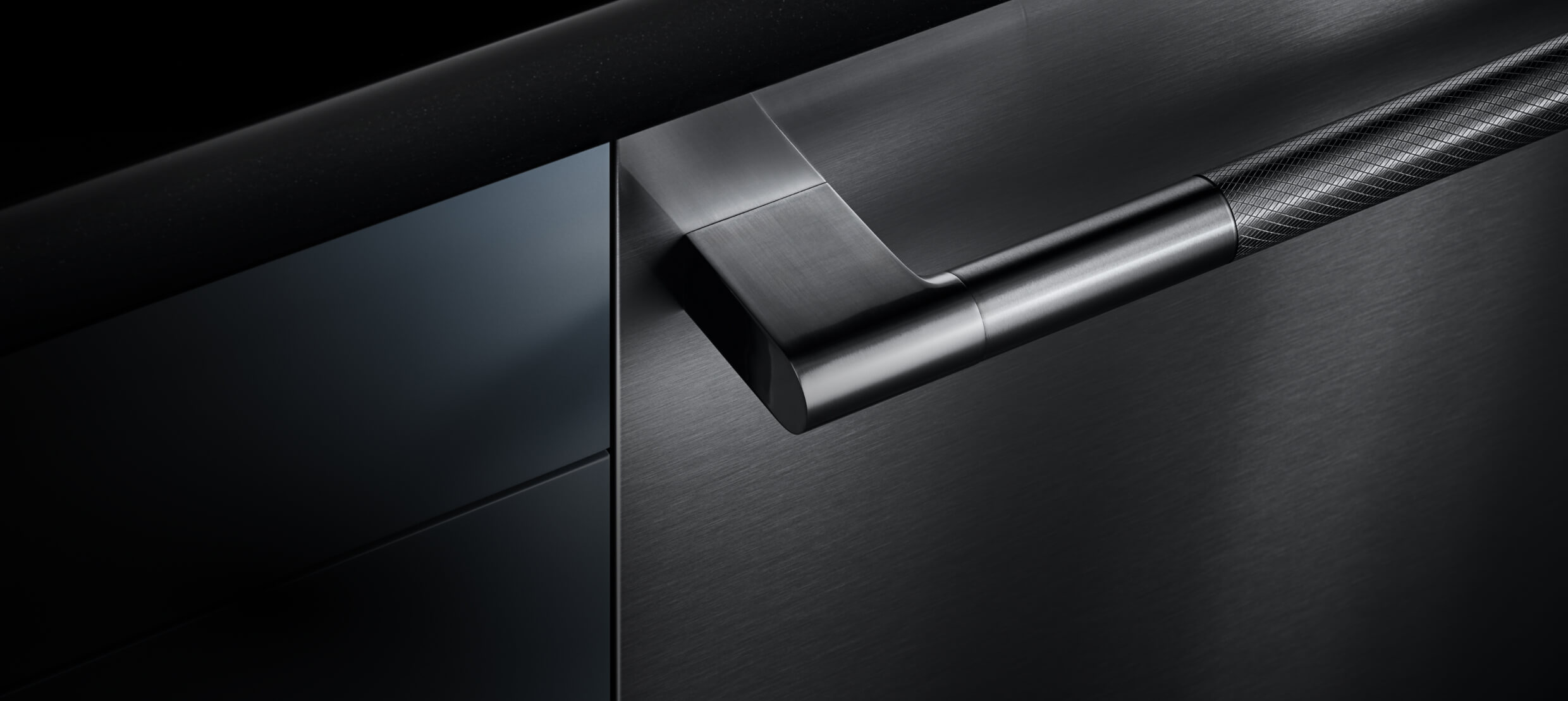 A dishwasher front and handle installed into a cabinet, showing off the fully flush design.