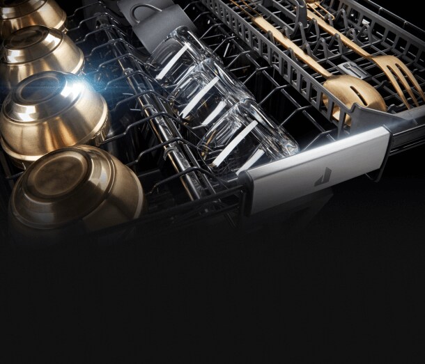 Dry, gleaming dishes in the 3rd rack of a dishwasher.