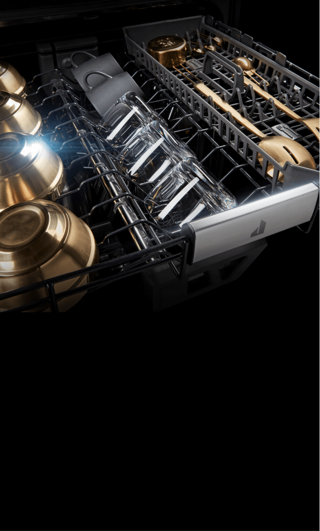 Dry, gleaming dishes in the 3rd rack of a dishwasher.