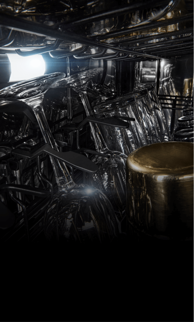 Wine glasses and tall water glasses in the middle rack of a dishwasher.