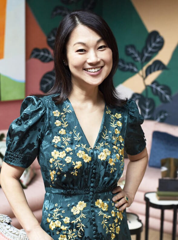 Designer Young Huh in a colorful, eclectic style room. 