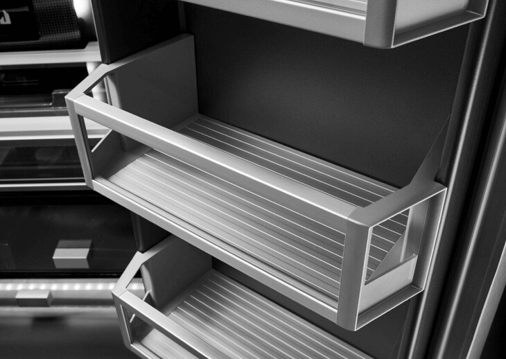The glass and metal shelves in a JennAir® freestanding refrigerator.