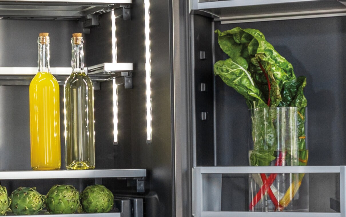 Two tall glass carafes in a JennAir® freestanding refrigerator.