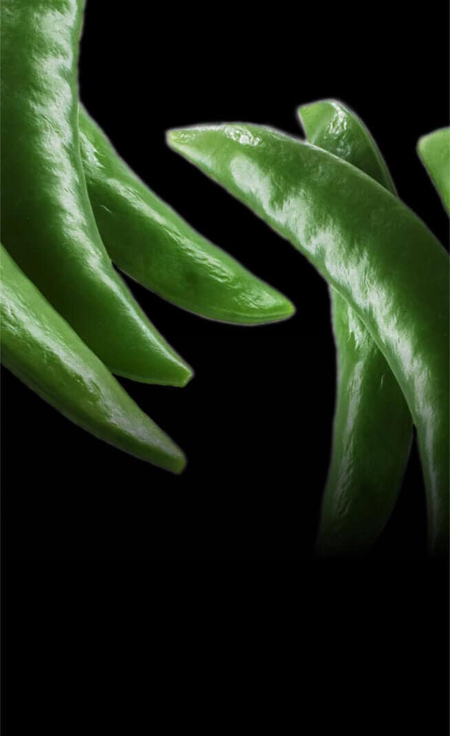 A series of steamed pea pods.