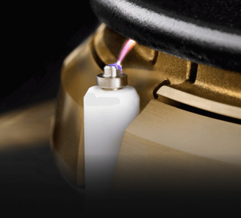 A close up of the lighting mechanism of a burner.