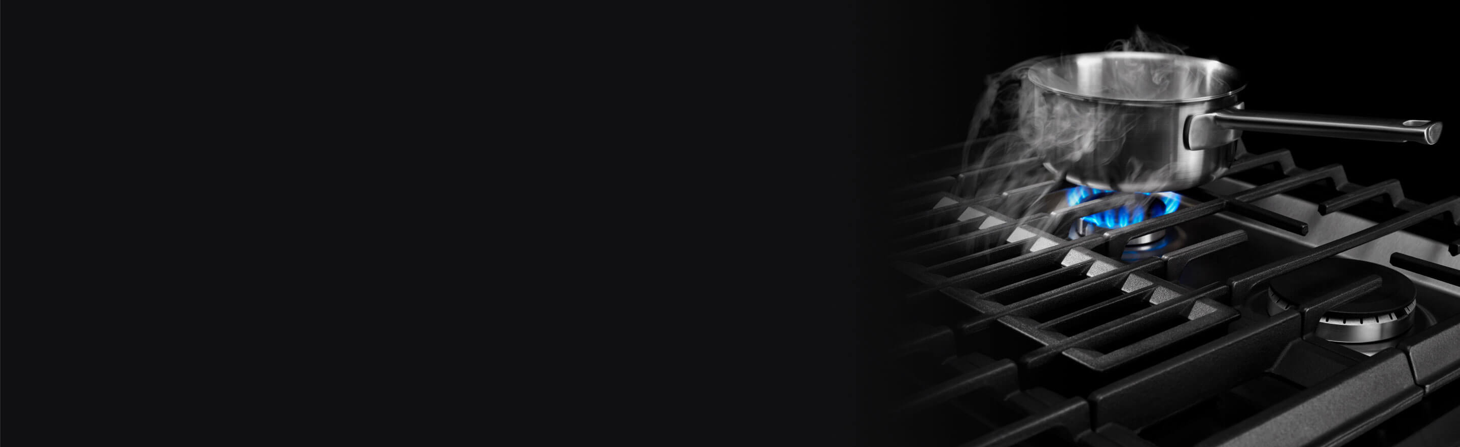 An image showing the entire view of a JennAir® Gas Slide-In Range, as well as the top of it.