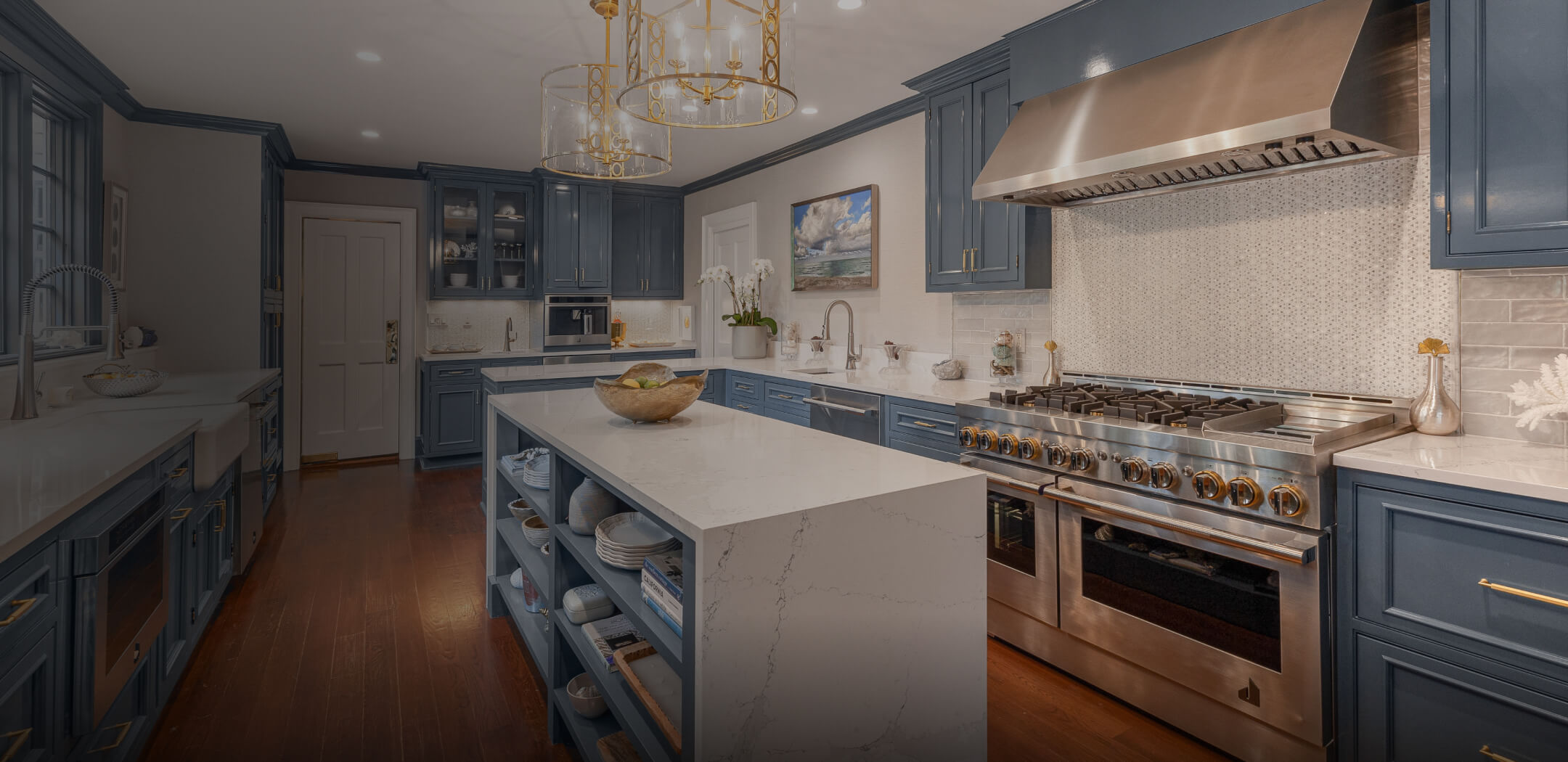 A JennAir® Professional-Style Range in a light blue luxury kitchen.