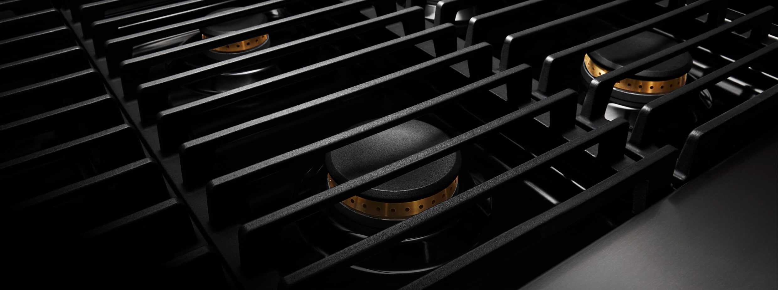 The grates on a JennAir® NOIR™ Rangetop.