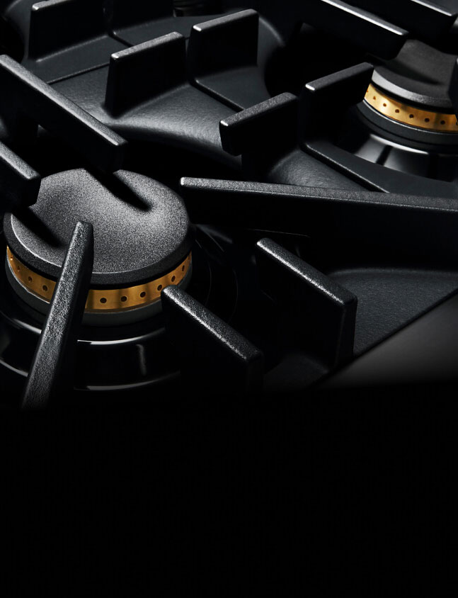 A close up of the geometric grates of a RISE™ Rangetop.