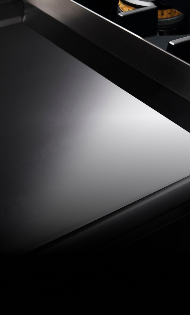 A Chrome-Infused Griddle on a gas rangetop.