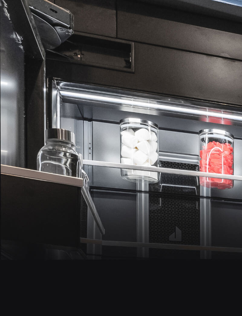 A close up of the hidden hinges on a JennAir® refrigerator.