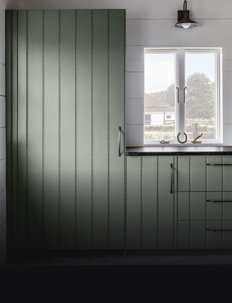 A panel-ready refrigerator seamlessly fitting in with surrounding cabinetry.