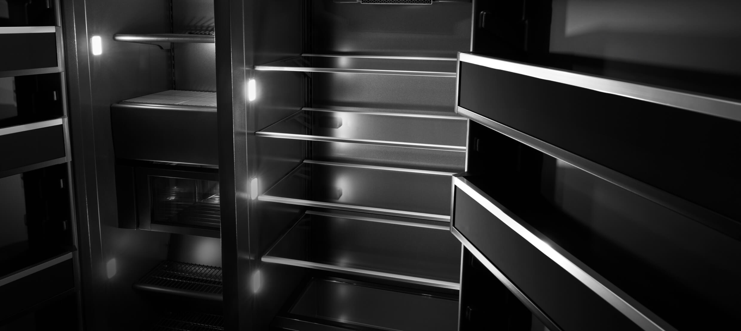  An open JennAir® Built-In Refrigerator, showing the multi-point lighting.