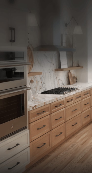 A contemporary kitchen with JennAir® appliances.