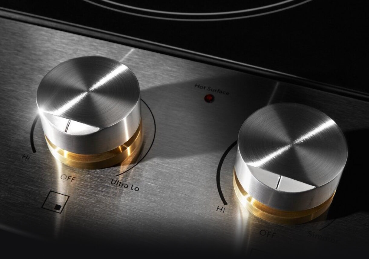 A close up the brass-inspired collars on the die-cast metal knobs.