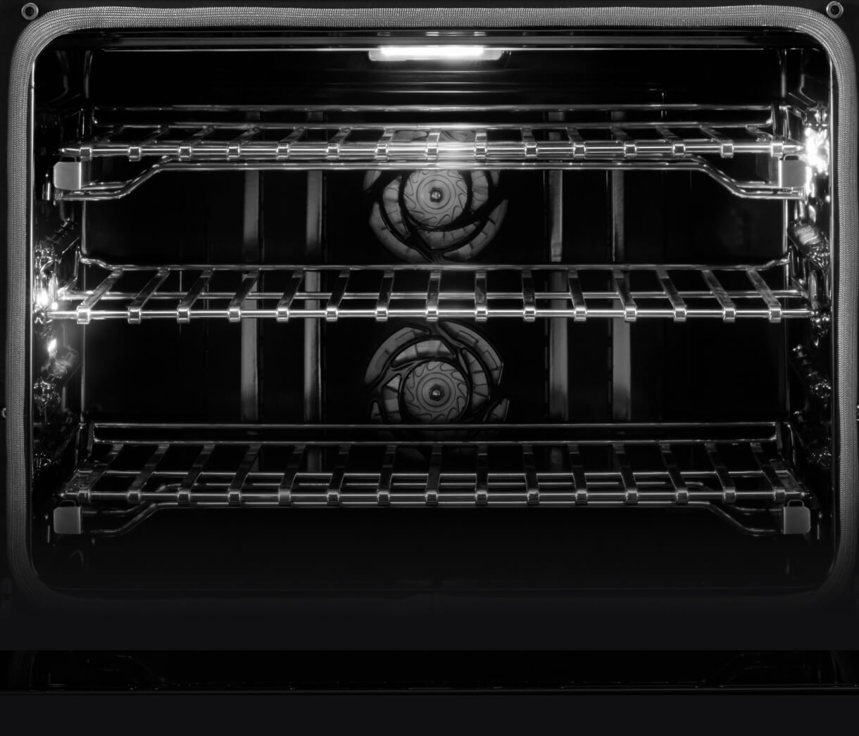 Interior view of a JennAir® Wall Oven, showing the dual convection fans.