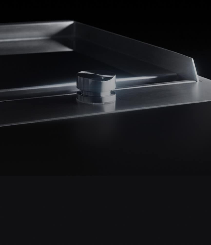 The slick chrome-infused surface of the griddle.