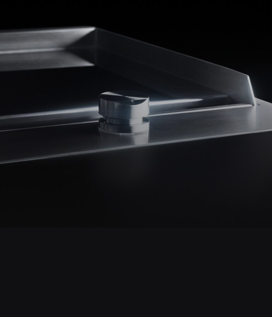 The slick chrome-infused surface of the griddle.