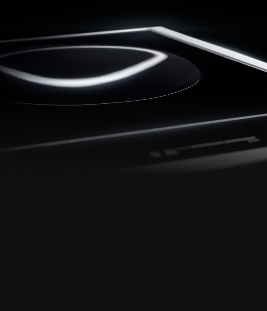 The 15-inch Induction Wok Cooktop with light highlighting the smooth concave wok element.