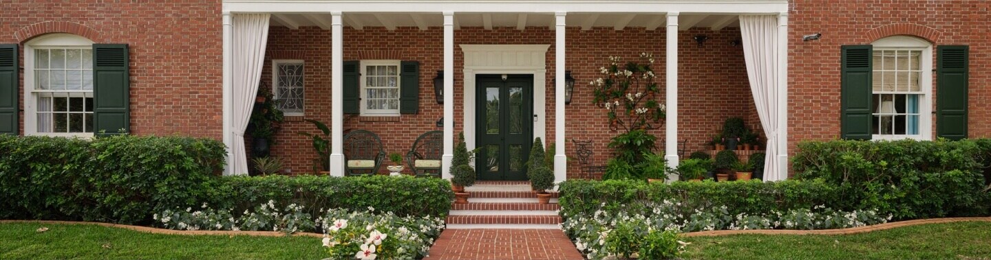 The exterior of a brick home.