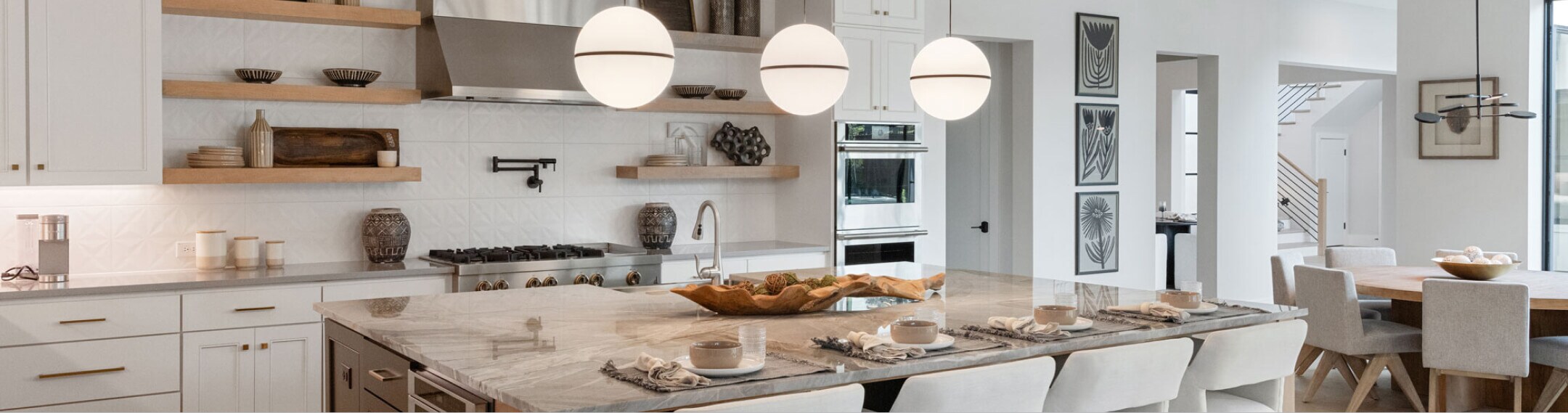 A bright, modern kitchen, outfitted with JennAir® appliances.